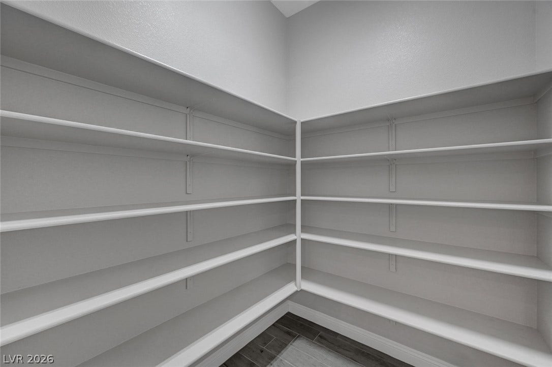6709 Titanium Crest Street, Las Vegas, NV 89148 Floor-to-ceiling wrap-around shelving provides abundant storage space in this walk-in pantry.