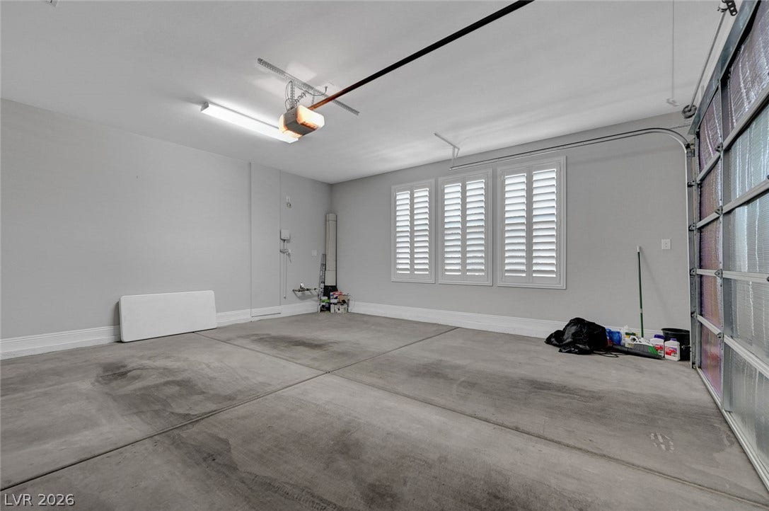 6709 Titanium Crest Street, Las Vegas, NV 89148 Two car garage with Plantation Shutters.