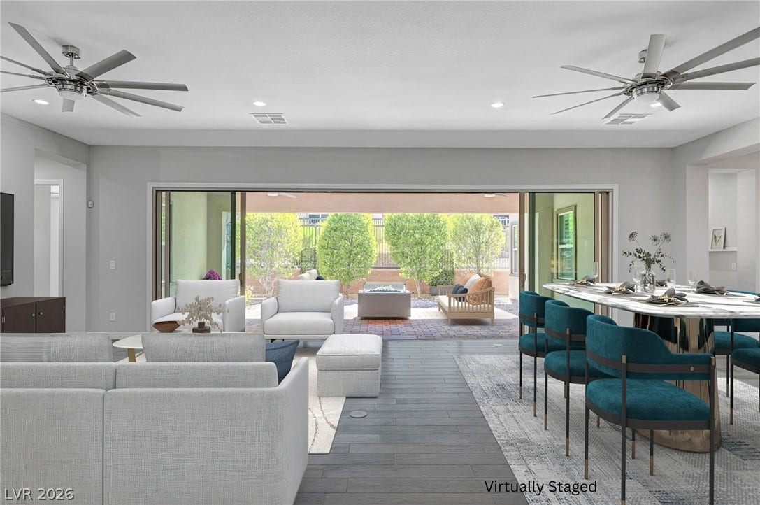 6709 Titanium Crest Street, Las Vegas, NV 89148 A spacious open-concept interior seamlessly flows to the backyard through expansive sliding doors.