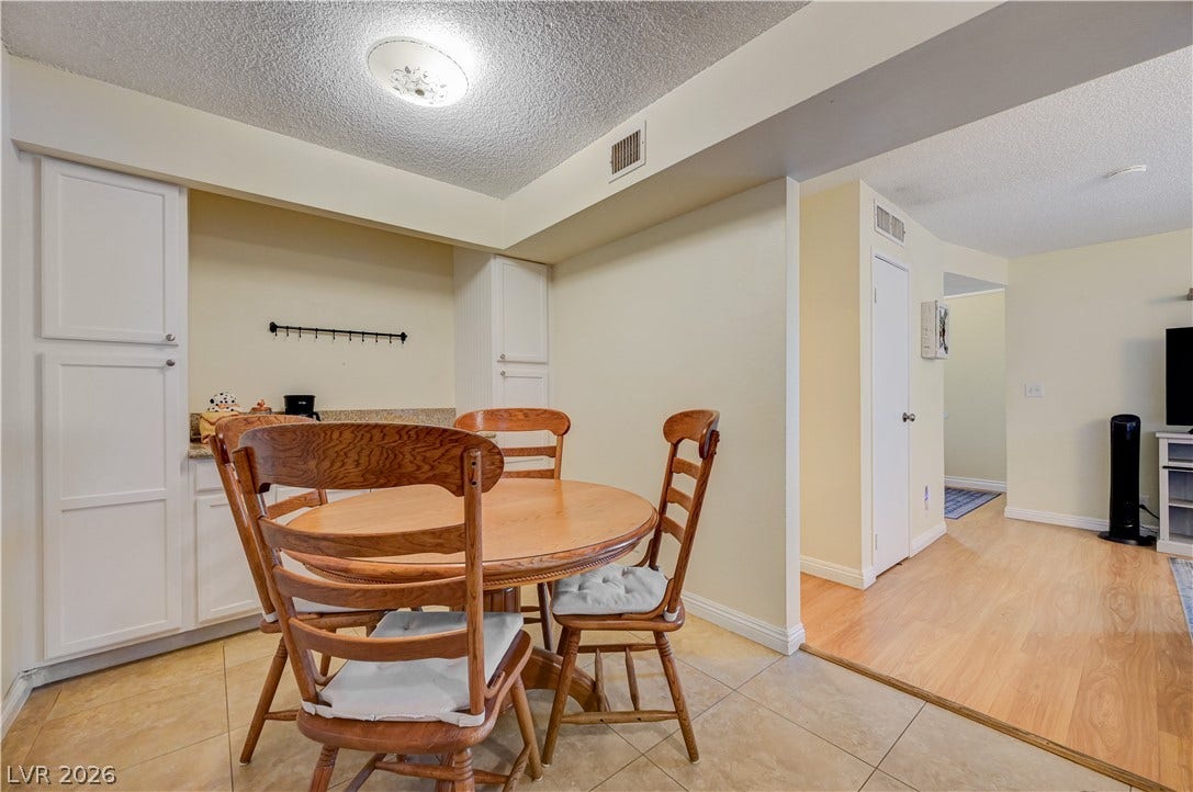 263 E Van Wagenen Street, Henderson, NV 89015 An open floor plan connects the tiled dining area to the adjacent living space.