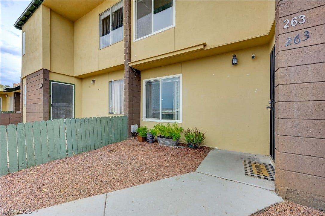 263 E Van Wagenen Street, Henderson, NV 89015 An inviting gated entry patio transitions smoothly into the private multi-level home exterior.
