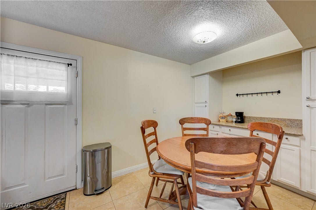 263 E Van Wagenen Street, Henderson, NV 89015 Tiled flooring and built-in cabinetry define this functional dining area.