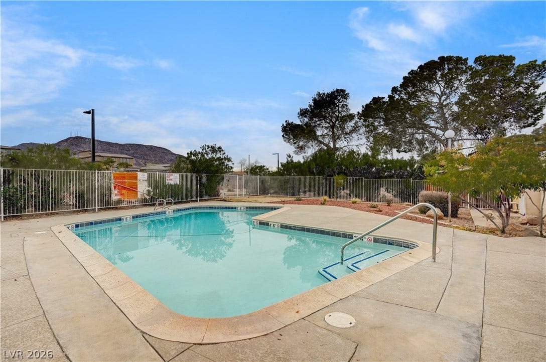 263 E Van Wagenen Street, Henderson, NV 89015 An inviting swimming pool is enclosed by secure fencing and bordered by spacious concrete decking.