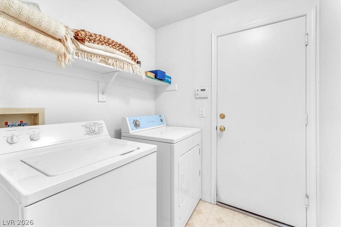 1163 Teal Point Drive, Henderson, NV 89074 Clothes washing area with laundry area, light floors, and washing machine and clothes dryer