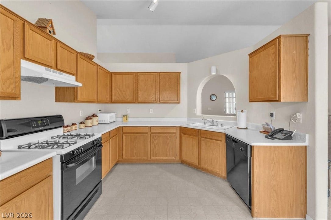 1163 Teal Point Drive, Henderson, NV 89074 Kitchen featuring range with gas stovetop, black dishwasher, light countertops, a sink, and under cabinet range hood