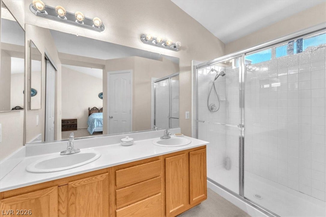 1163 Teal Point Drive, Henderson, NV 89074 Bathroom with a stall shower, double vanity, a sink, and ensuite bathroom