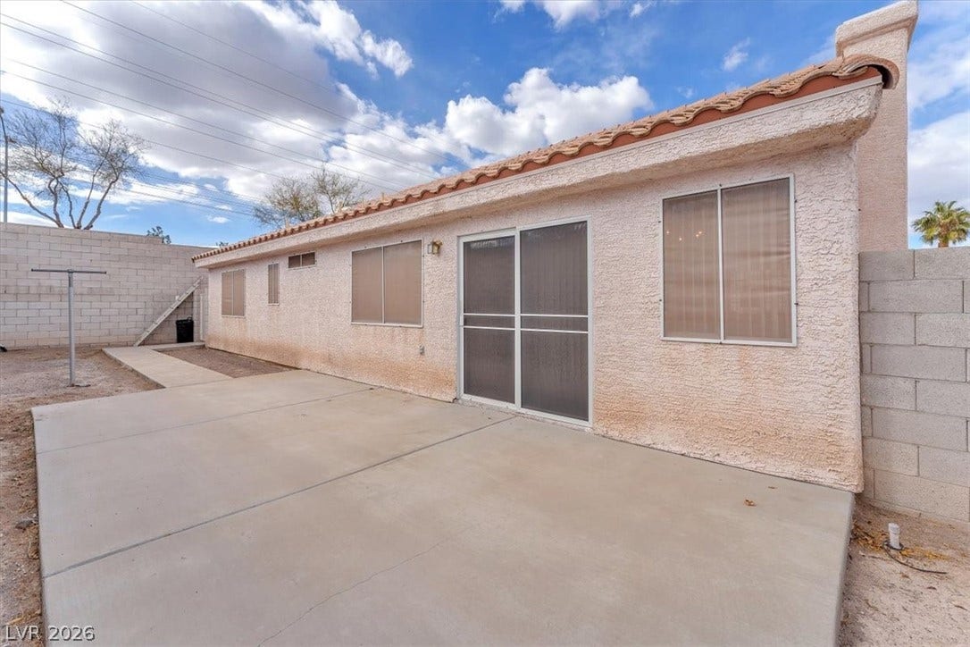 1163 Teal Point Drive, Henderson, NV 89074 Rear view of property with a patio, a tile roof, fence, and stucco siding