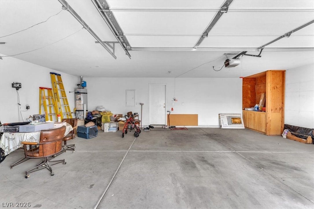 1163 Teal Point Drive, Henderson, NV 89074 Garage featuring electric panel and a garage door opener