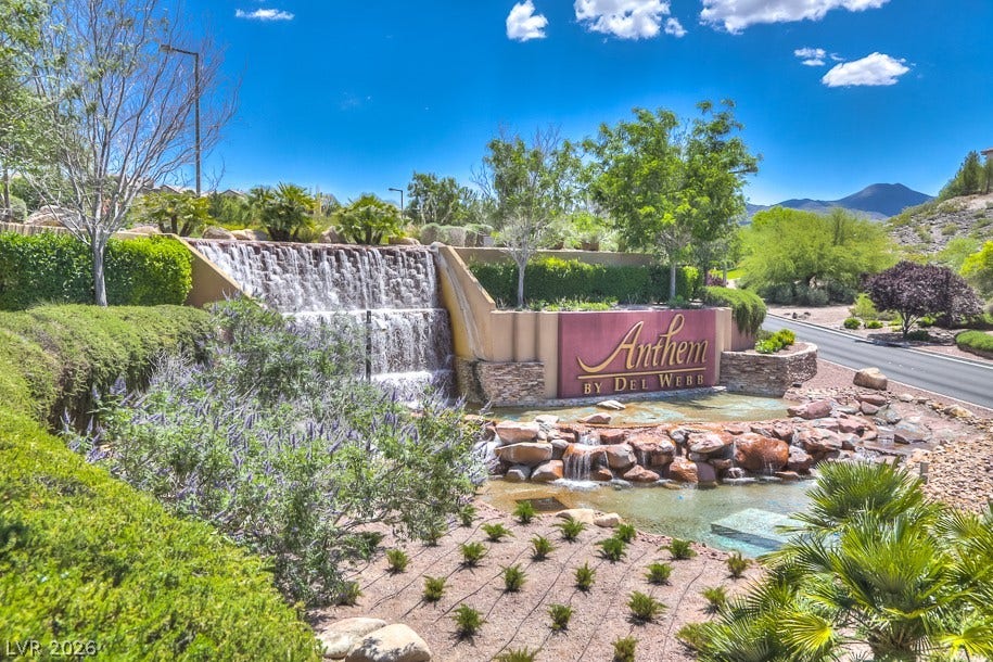2306 Schaeffer Hills Drive, Henderson, NV 89052 Welcoming waterfall feature with lush landscaping creates a grand entrance to this community.