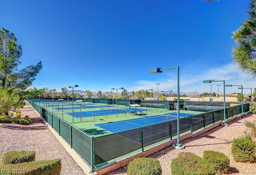 2306 Schaeffer Hills Drive, Henderson, NV 89052 Numerous well-maintained tennis courts await your serve under an azure sky.