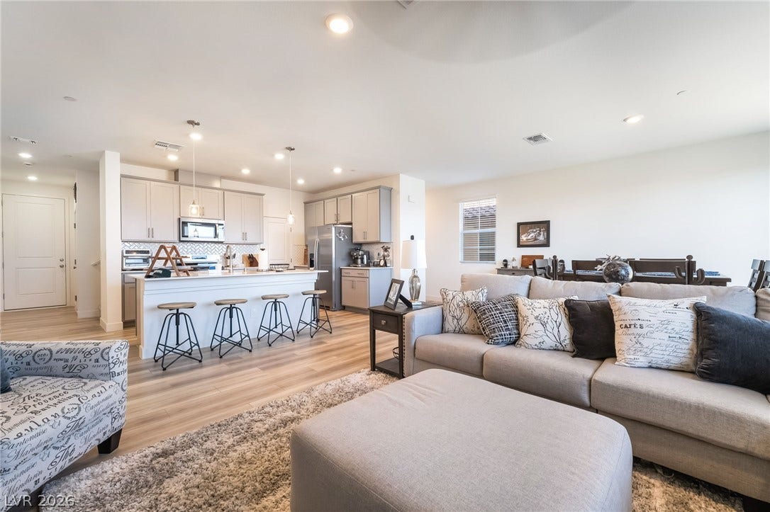 2966 Gallarate Drive, Henderson, NV 89044 An open-concept living space with a kitchen island flows seamlessly into the comfortable living area.
