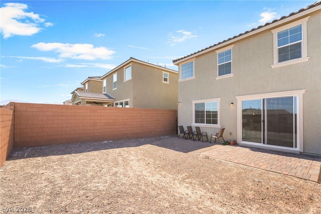 2966 Gallarate Drive, Henderson, NV 89044 A spacious backyard with a patio, ready for your personalized outdoor oasis.