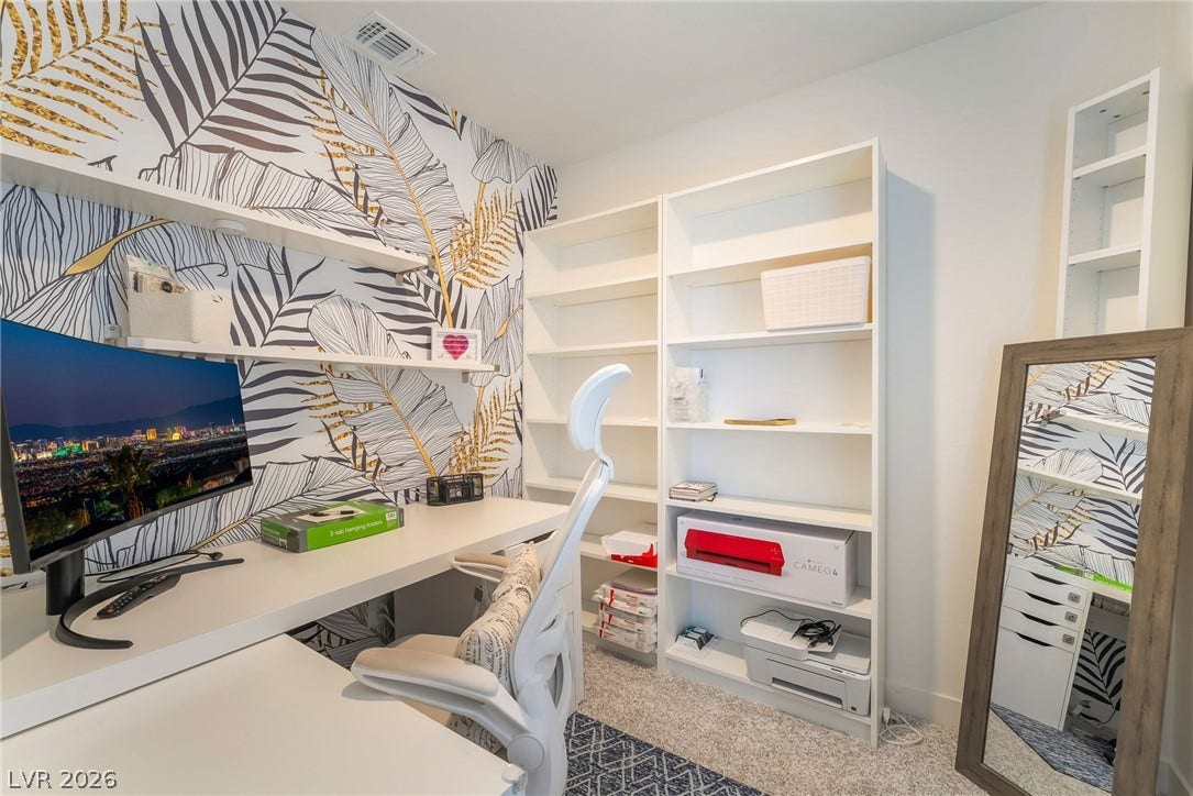 2966 Gallarate Drive, Henderson, NV 89044 A dedicated home office provides ample built-in shelving and desk space for productivity.