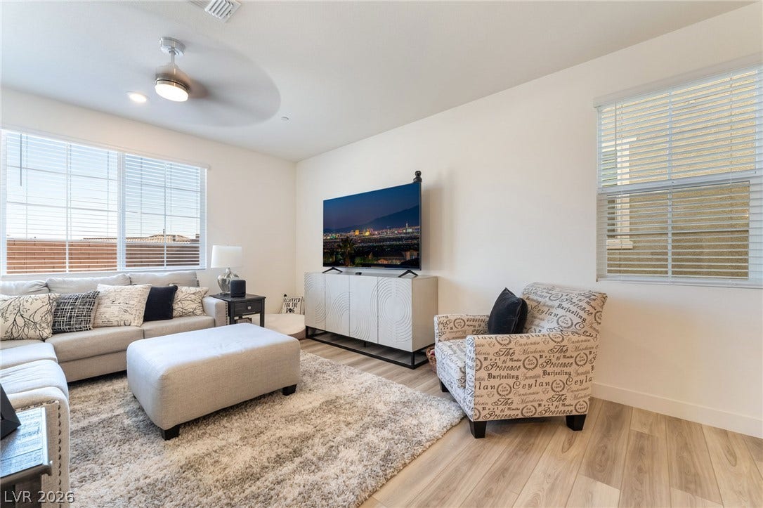2966 Gallarate Drive, Henderson, NV 89044 A comfortable living space boasts durable hardwood flooring and generous natural light.