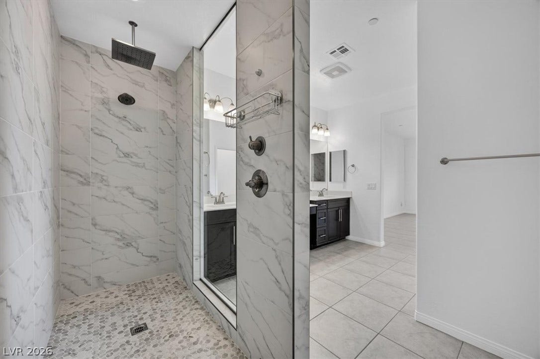 A chic shower and vanity area presents modern amenities for daily refreshment.