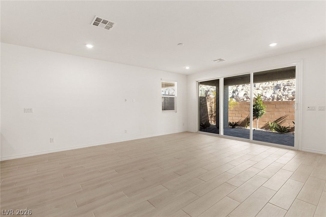 9986 Joshua Foothills Street, Las Vegas, NV 89178 Sliding glass doors open to a private outdoor space, creating an effortless indoor-outdoor flow.