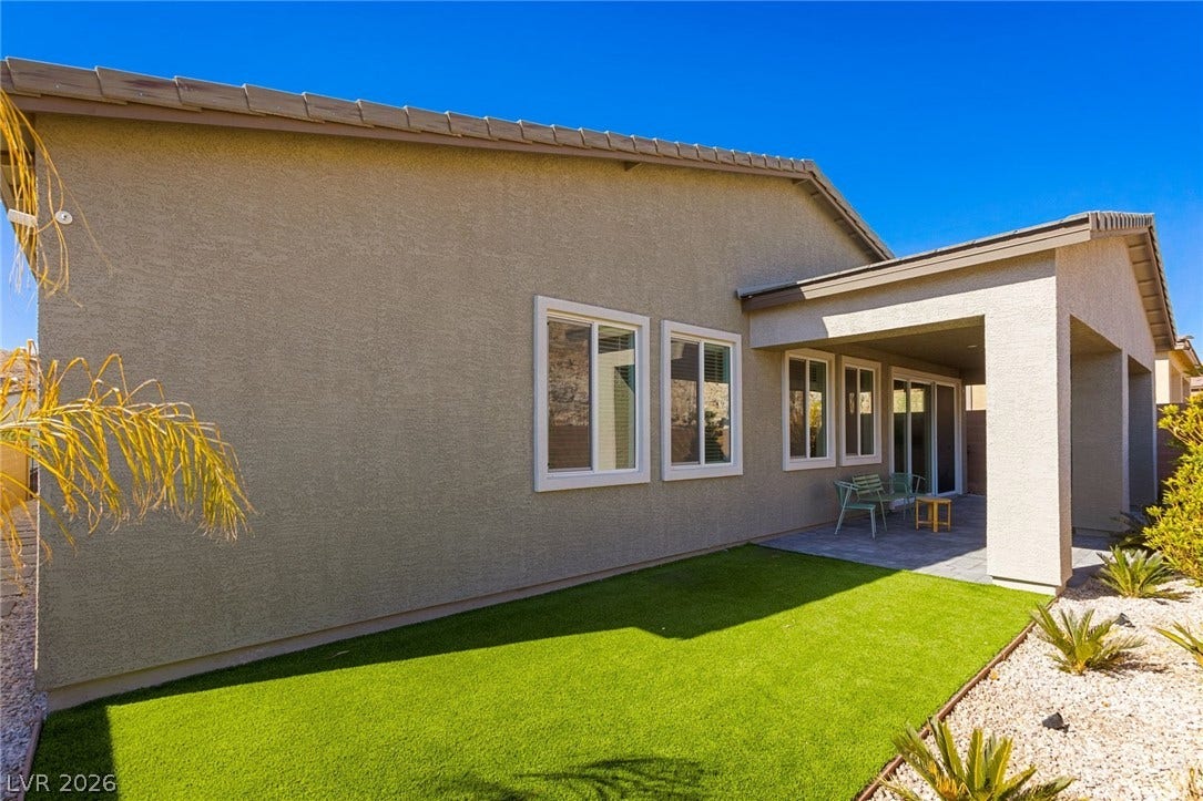 9986 Joshua Foothills Street, Las Vegas, NV 89178 A private outdoor space features a covered patio area and low-maintenance landscaping.