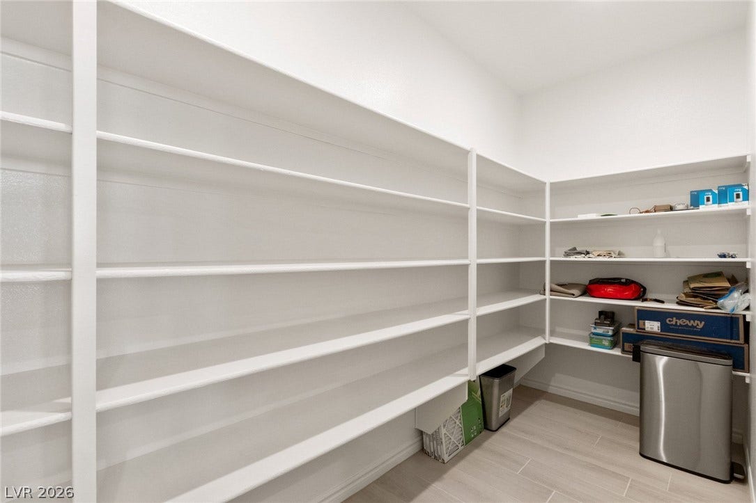 9986 Joshua Foothills Street, Las Vegas, NV 89178 Ample shelving in this walk-in pantry provides generous storage space.