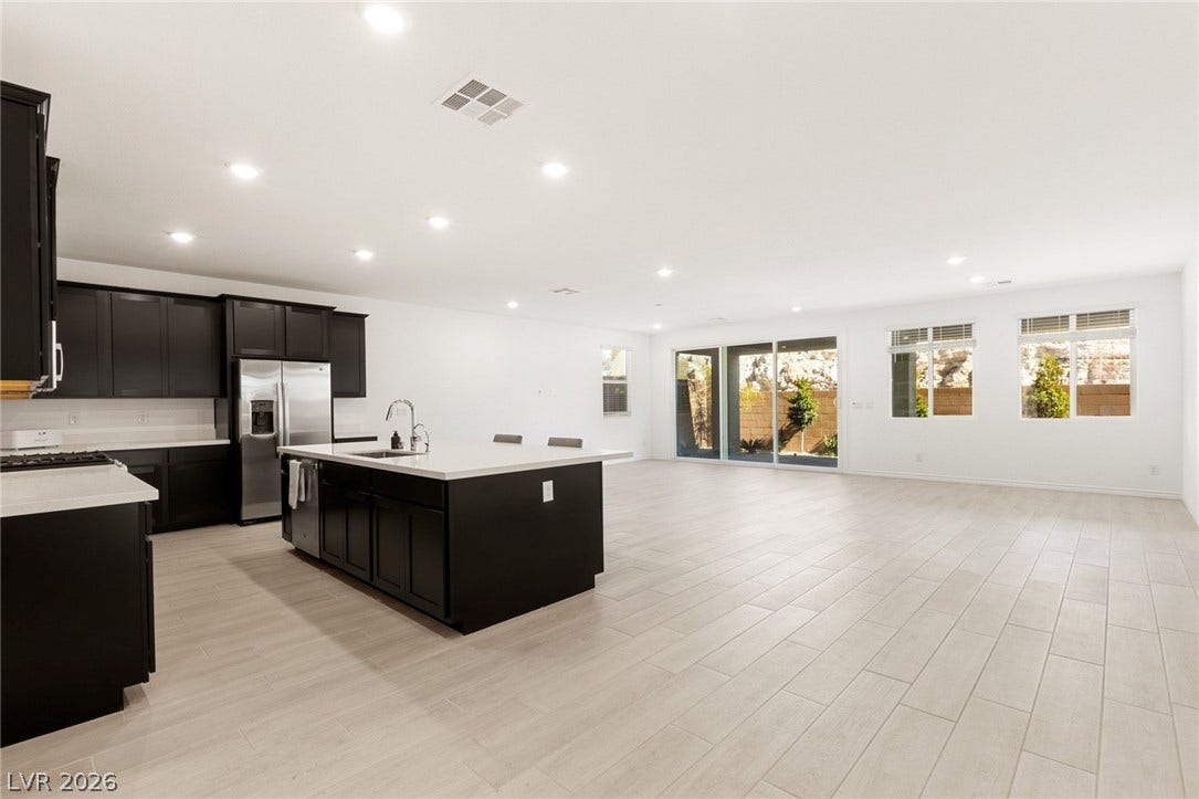 9986 Joshua Foothills Street, Las Vegas, NV 89178 An open-concept living space with a contemporary kitchen island anchors this inviting home.