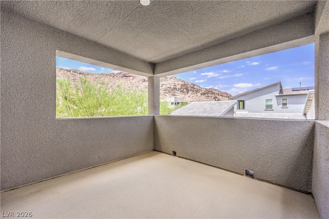 1984 Canyon Highlands Drive, Henderson, NV 89052 An inviting private balcony offers inspiring mountain vistas and serene outdoor living form the loft.