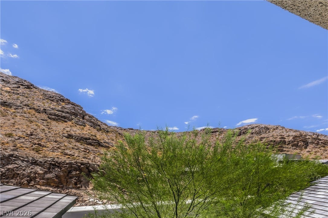 1984 Canyon Highlands Drive, Henderson, NV 89052 A tranquil desert mountain view under a wide-open blue sky awaits.