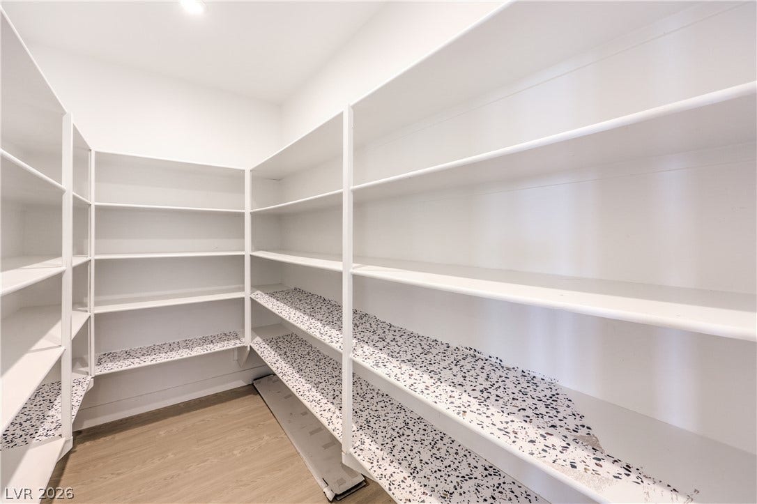 1984 Canyon Highlands Drive, Henderson, NV 89052 Ample built-in shelving and light wood flooring provide excellent storage capacity in this organized pantry.