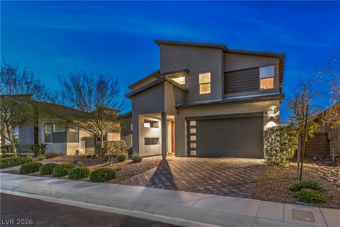 1984 Canyon Highlands Drive, Henderson, NV 89052 Modern architecture and thoughtful landscaping frame this welcoming residence at dusk.
