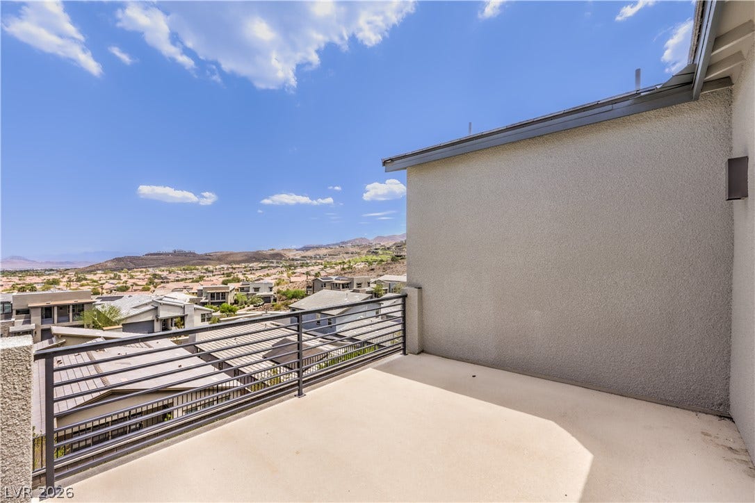 1984 Canyon Highlands Drive, Henderson, NV 89052 A private balcony offers elevated views of the sprawling desert landscape and distant mountain ranges.