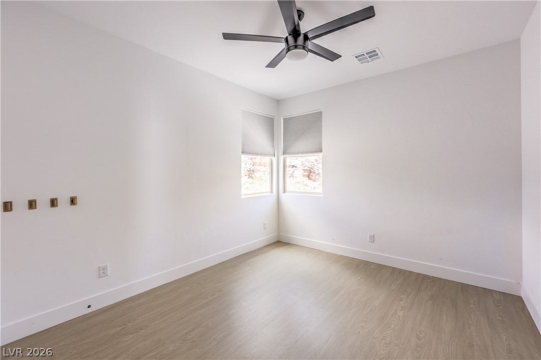 1984 Canyon Highlands Drive, Henderson, NV 89052 A well-lit room featuring corner windows and modern flooring, ideal for a peaceful retreat.