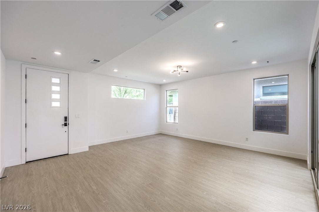 1984 Canyon Highlands Drive, Henderson, NV 89052 An airy living space features resilient flooring, contemporary lighting, and abundant natural light from well-placed windows.