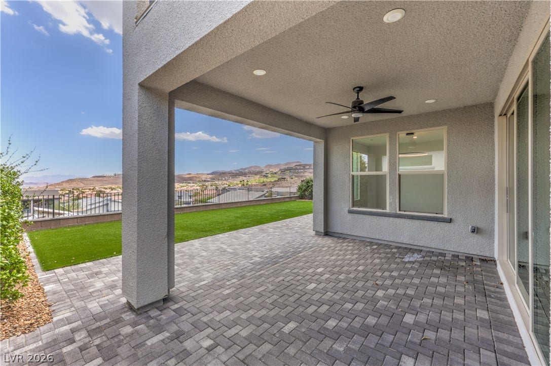1984 Canyon Highlands Drive, Henderson, NV 89052 An inviting covered patio offers a private outdoor retreat with scenic hill and community views.