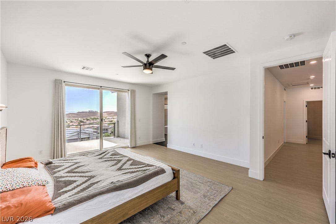 1984 Canyon Highlands Drive, Henderson, NV 89052 A tranquil bedroom suite offers direct balcony access and scenic mountain views.