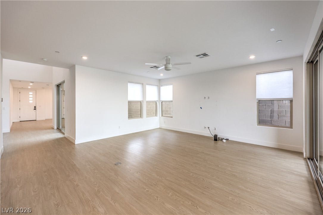 1984 Canyon Highlands Drive, Henderson, NV 89052 Bright and open, this living space showcases expansive windows and durable flooring.