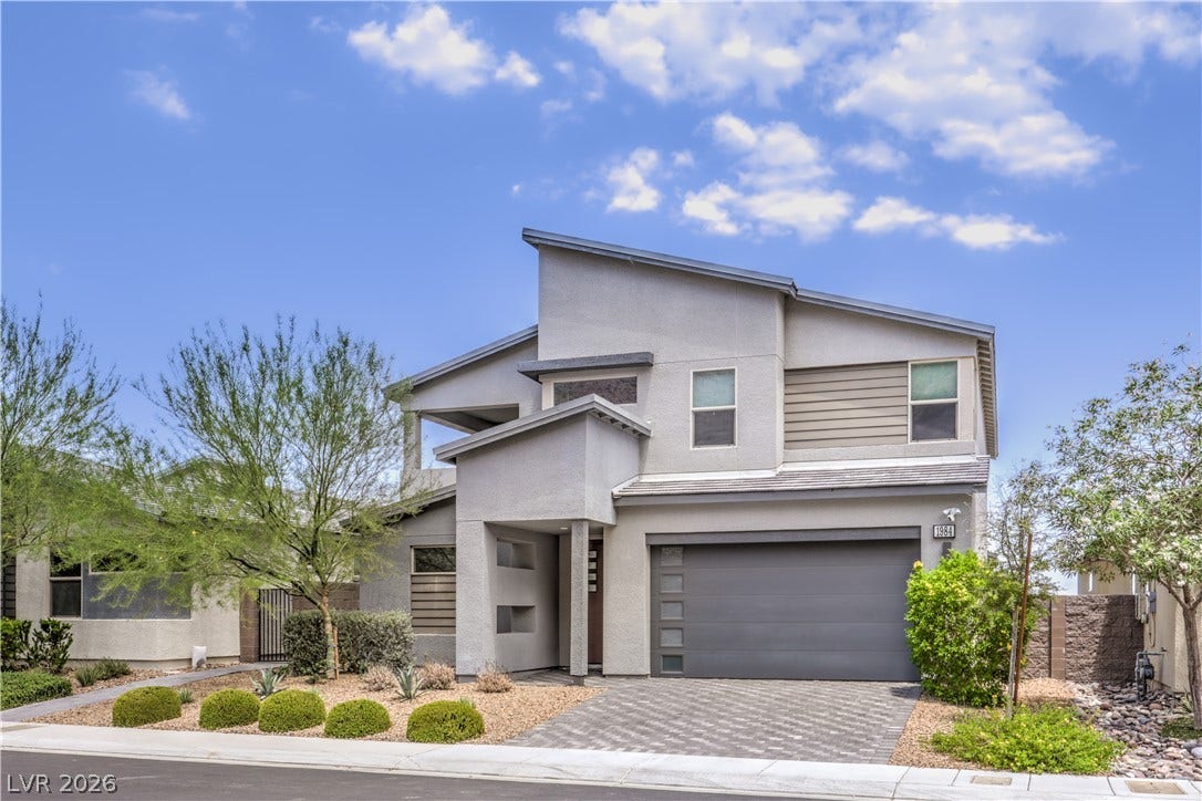 1984 Canyon Highlands Drive, Henderson, NV 89052 A striking modern facade with clean lines and mixed materials presents inviting curb appeal.