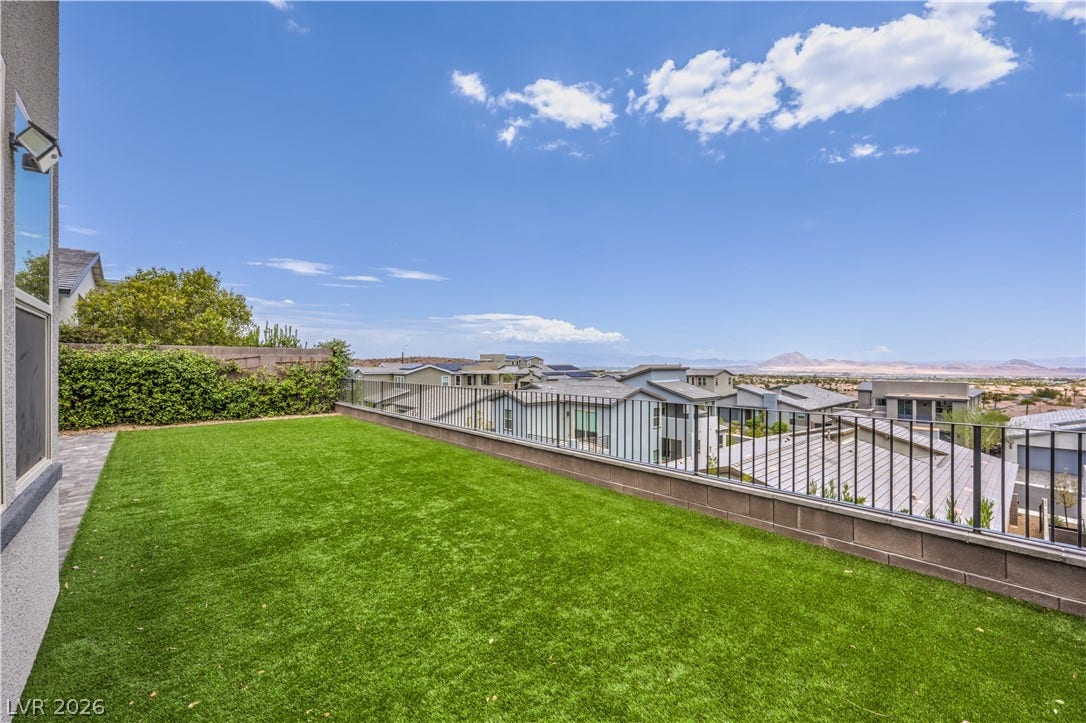 1984 Canyon Highlands Drive, Henderson, NV 89052 A pristine turf lawn overlooks a vibrant neighborhood with distant mountain vistas.