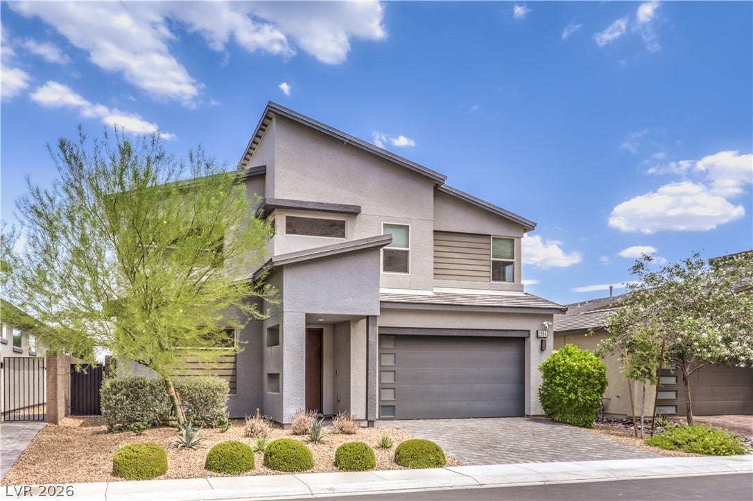 1984 Canyon Highlands Drive, Henderson, NV 89052 A modern facade with striking architectural lines and a paver driveway welcomes you home.