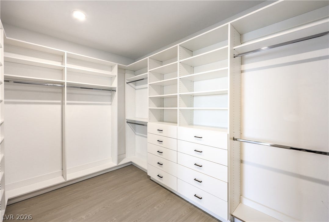 1984 Canyon Highlands Drive, Henderson, NV 89052 Ample built-in shelving and hanging rods organize this spacious walk-in closet.