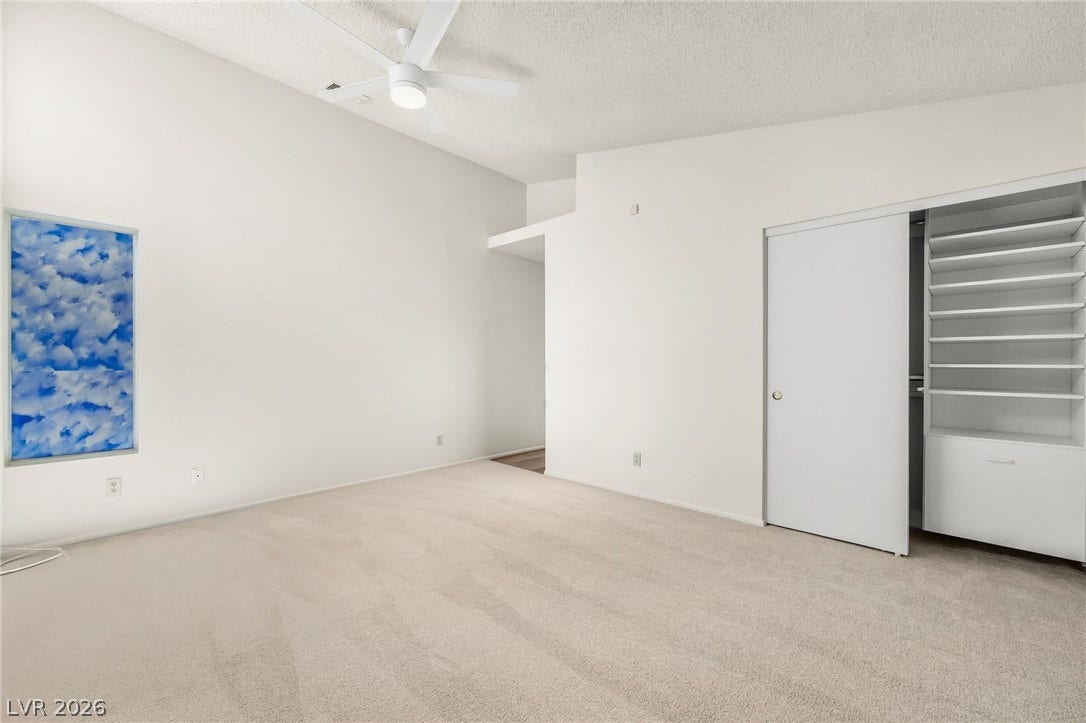 62 Tidwell Lane, Henderson, NV 89074 A vaulted ceiling, soft carpeting, and custom closet built-ins define this serene retreat.