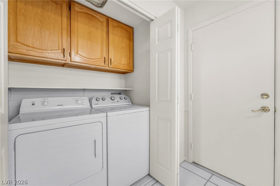 62 Tidwell Lane, Henderson, NV 89074 Functional tile flooring and wood cabinetry maximize storage in this dedicated laundry space.