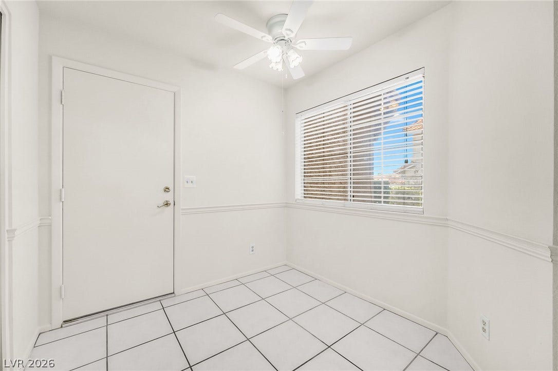 62 Tidwell Lane, Henderson, NV 89074 A light-filled breakfast area features tiled floors and clean wainscoting.
