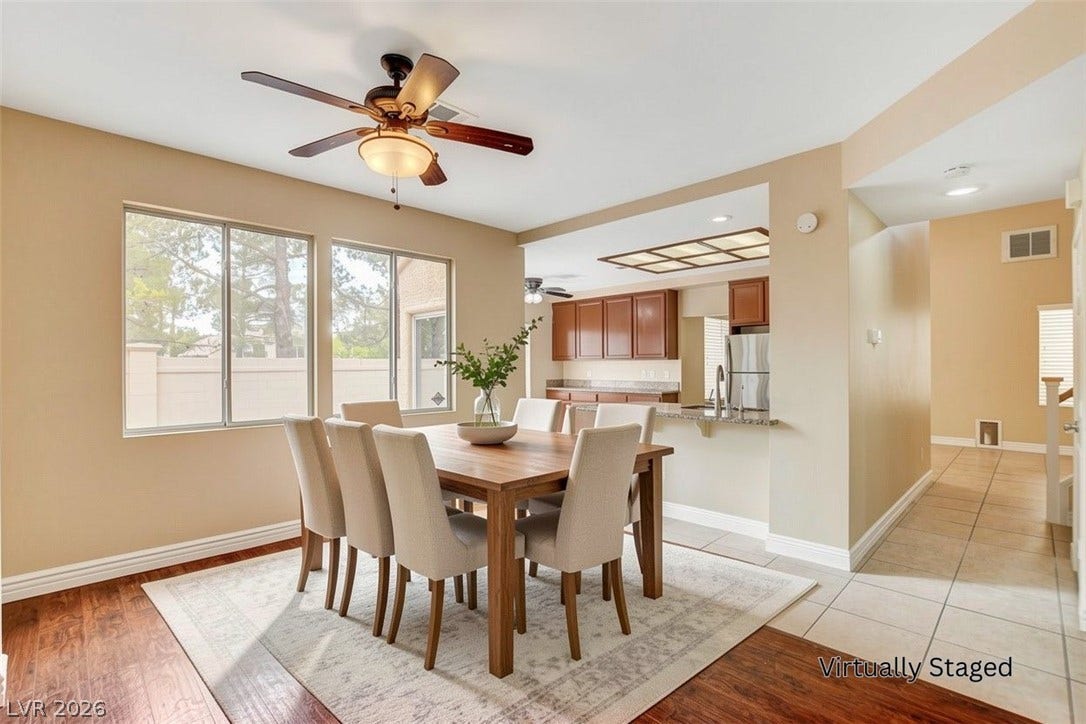 1612 Country Hollow Drive, Las Vegas, NV 89117 An inviting dining area offers a seamless flow into the kitchen, ideal for entertaining and daily living.