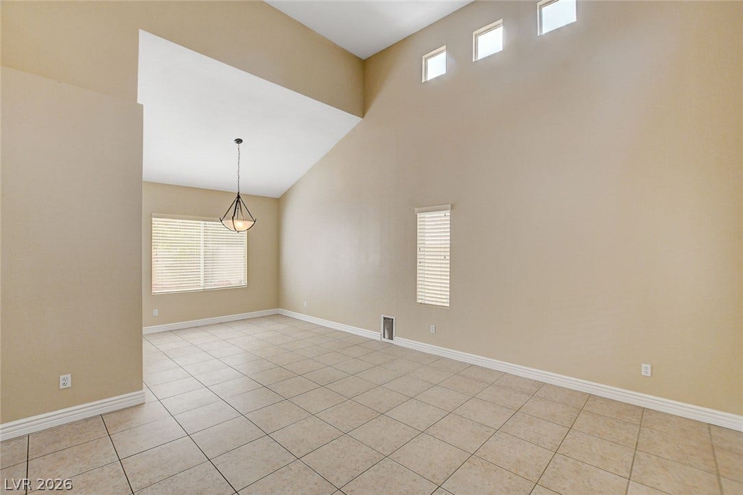 1612 Country Hollow Drive, Las Vegas, NV 89117 Lofty ceilings and tile flooring enhance this spacious interior with abundant natural light.