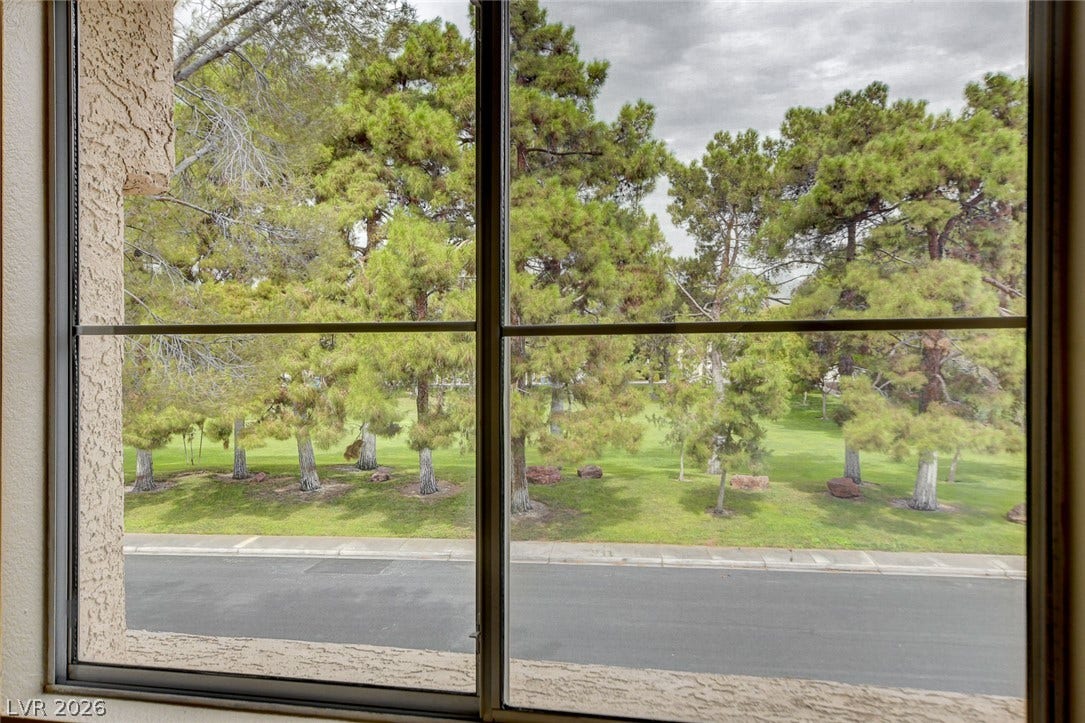 1612 Country Hollow Drive, Las Vegas, NV 89117 Green landscaping and mature trees provide a pleasant view from the sliding glass door.