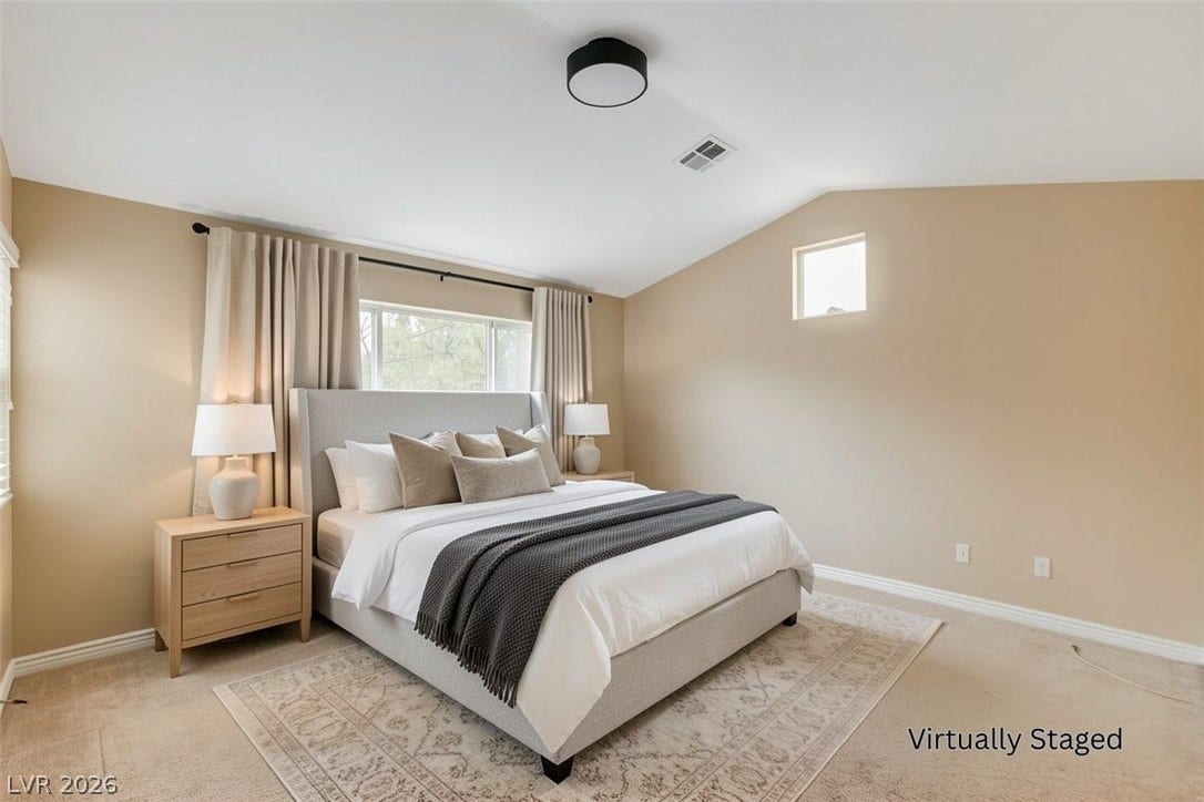 1612 Country Hollow Drive, Las Vegas, NV 89117 Well-lit sleeping quarters with sloped ceilings and ample natural light.