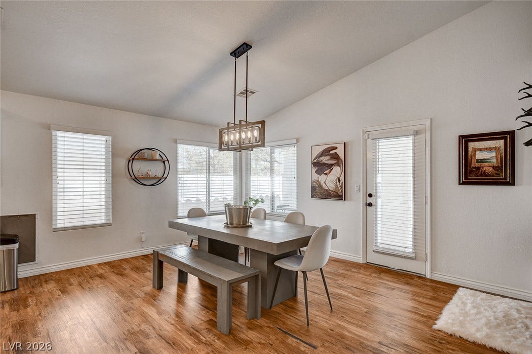 236 Misty Garden Street, Henderson, NV 89012 Vaulted ceilings and warm wood floors define this welcoming dining area.