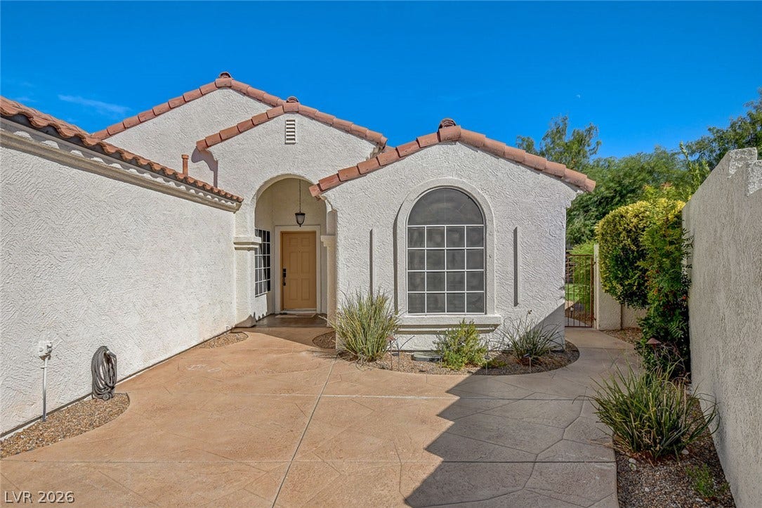 236 Misty Garden Street, Henderson, NV 89012 Textured stucco walls and a tile roof define the exterior of this Southwestern-style home.