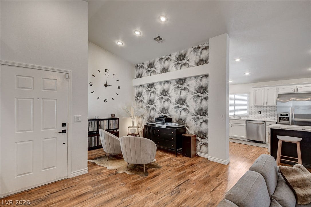 236 Misty Garden Street, Henderson, NV 89012 Rich hardwood flooring anchors an inviting open concept living space with recessed lighting.