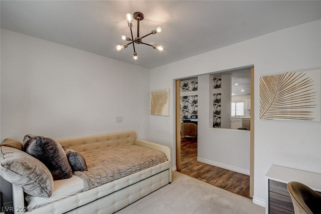 236 Misty Garden Street, Henderson, NV 89012 Smooth plaster walls and plush flooring define this versatile secondary space.