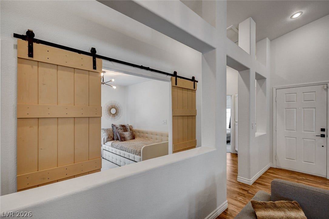 236 Misty Garden Street, Henderson, NV 89012 High ceilings and modern wood-look flooring enhance this inviting entry and living space.