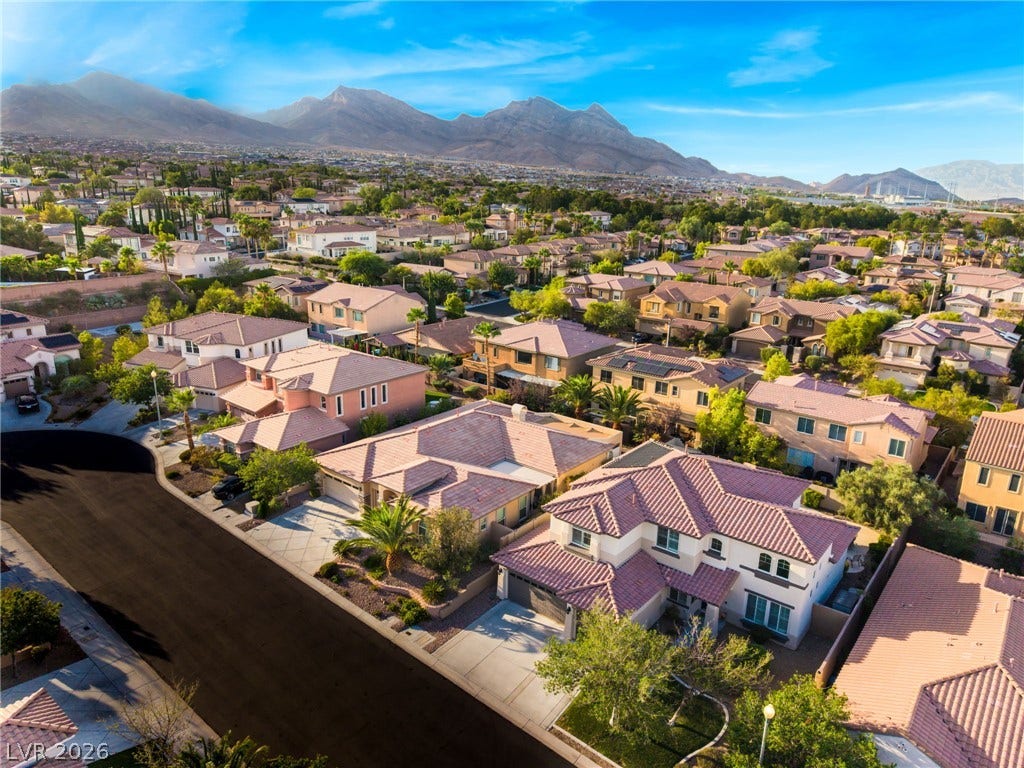 11416 Rancho Portena Avenue, Las Vegas, NV 89138 Majestic mountain peaks provide a dramatic backdrop for this vibrant desert neighborhood.